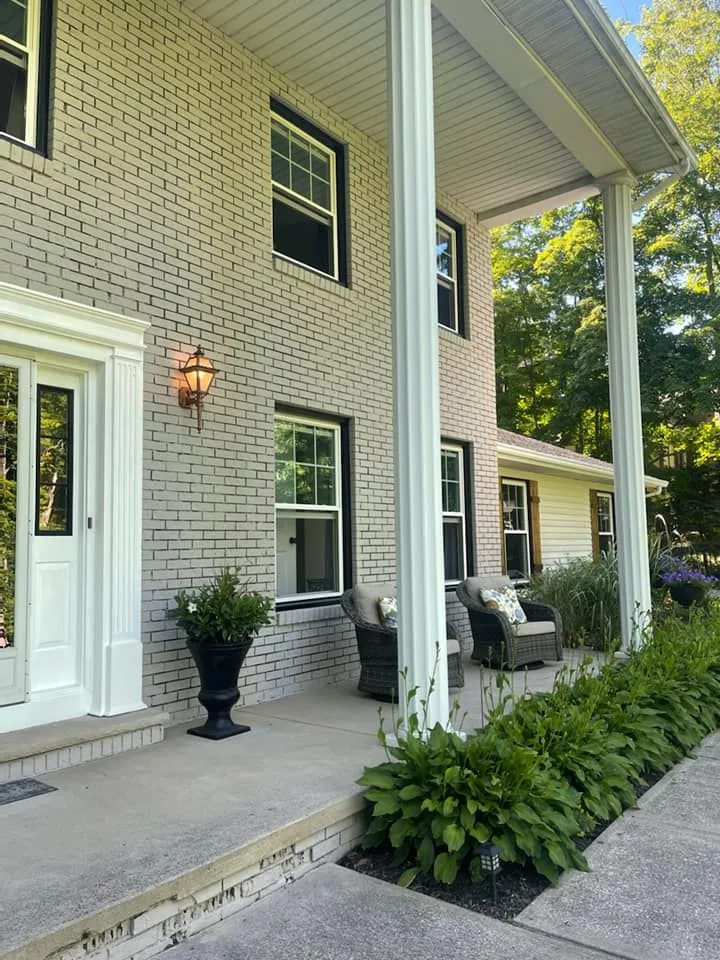 Home exterior with new entry door installed by Just Windows USA