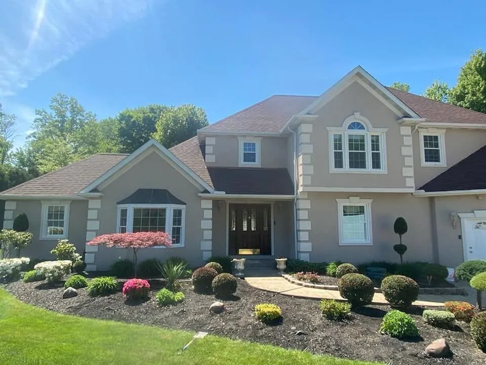Home exterior showing completed window and door replacement by Just Windows USA